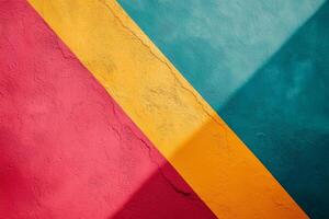 Abstract wall art featuring a red yellow and teal painted surface with a diagonal pattern and shadow photo