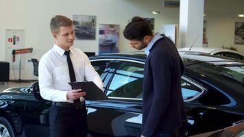 Salesman enthusiastically presents clipboard to client during handshake video