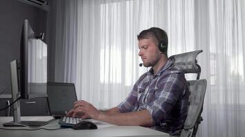 Focused customer support operator diligently typing on a computer video