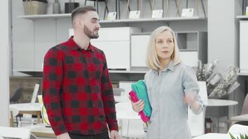 Stylish couple exploring a modern furnishings store video