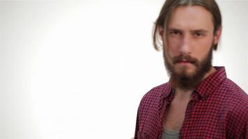 Stylish hipster man striking a pose in a modern studio video