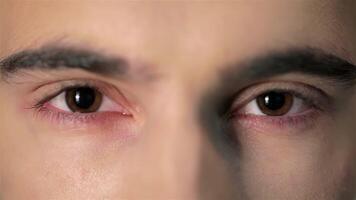 Intense close-up of a handsome man with captivating eyes video