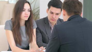 Young couple engages in a dynamic business consultation with an analyst video