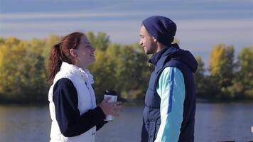 Joyful couple enjoying coffee after a refreshing jog video