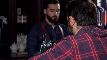 Cheerful male customer enjoying a refreshing craft beer at the pub video