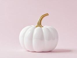 Elegant white ceramic pumpkin with gold stem on soft pink background for modern decor photo