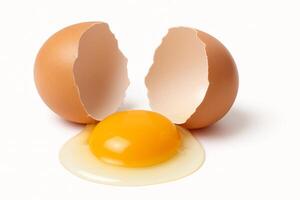 An egg is broken in half on a white background photo