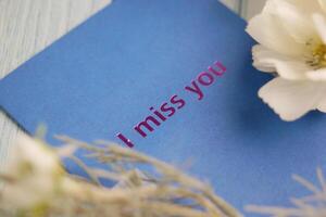 Expressing feelings with a heartfelt message on a blue card photo