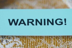 Warning sign displayed prominently on a surface photo