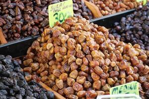 Fresh dates displayed at a local market in the afternoon sun photo