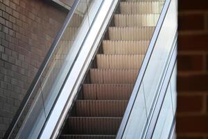 Moving walkway in a modern building during daylight hours photo