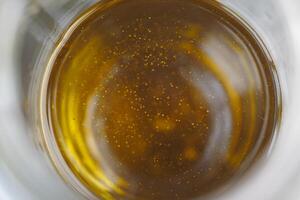 top view of olive oil in a container photo