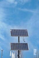 Solar panels capturing sunlight in an urban environment photo