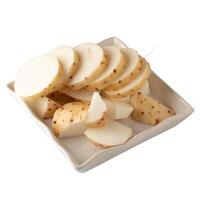 Raw Yamaimo roots and slices or Chinese yam isolated over white background photo