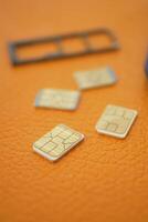 SIM cards placed on a textured surface during device setup photo