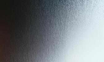 Dark Gray Frosted Texture Fading to White - Abstract Gradient Background with Grainy Surface Transition photo