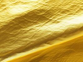 Crinkled Gold Foil Texture Background - Abstract Shiny Metallic Paper Surface with Deep Creases and Reflections photo