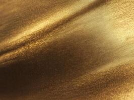 Brushed Gold Bronze Metal Texture Background - Abstract Warm Metallic Surface with Angled Light and Shadow photo