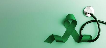 Mental Health Awareness Concept. Self Care, Positive Thinking, Happy and Optimistic Mind. a Green Ribbon and Stethoscope lay on Green background. Table top view photo