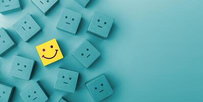 Mind, Mental Health Concept. a Unique Smiling Cube that Stand Out among Crowd photo