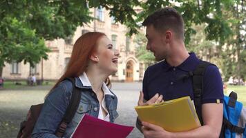 Two students share a joyful conversation on campus video