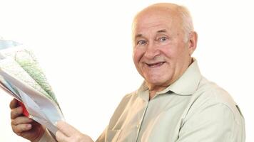 Joyful senior man exploring a map with a bright smile video