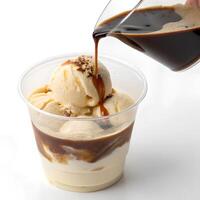 A cup of affogato with espresso poured over ice cream., isolated on a clean white background photo