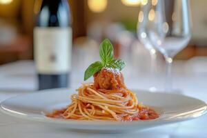 Italian spaghetti with meatballs and tomato sauce with basil. photo