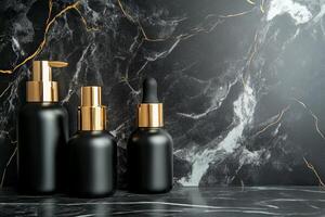 Cosmetic bottles in black and gold on marble background. photo