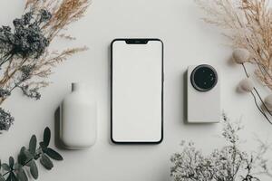 Smartphone with a white screen on a light grey background. photo