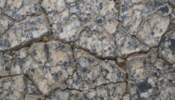 Raw granite surface with intricate fissures and mineral veins. photo