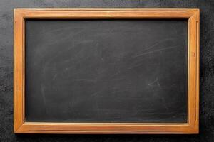 Chalkboard, wooden frame isolated on dark grey background. photo
