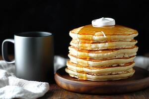 Stack of Pancakes Drizzled with Syrup and Whipped Cream photo