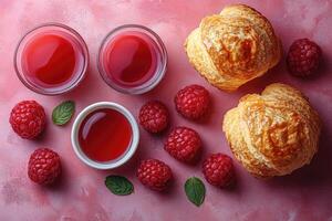 Raspberry, Pastry, and Red Juice on Pink Background photo