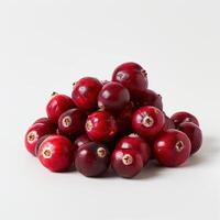 A collection of cranberries neatly organized in a pyramid shape, displayed on a white background. photo