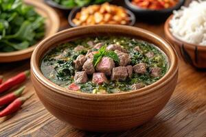 Beef and Spinach Soup with Basil in a Brown Bowl photo