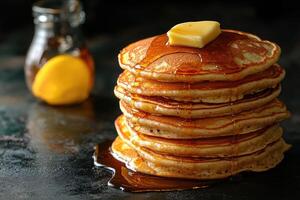 Stack of Buttery Pancake Drizzled with Syrup photo