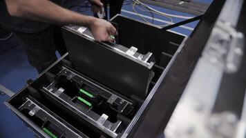 Technician placing LED screen panels into protective case video