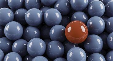 A group of blue spheres with a single orange sphere standing out, useful for illustrating concepts like leadership, uniqueness, standing out from the crowd, and individuality. photo
