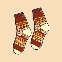 Pair of brown socks with classic pattern isolated on beige background vector