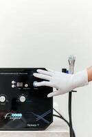 Facial hydro vacuum microdermabrasion machine. Peeling treatment. Cosmetology clinic. Facial therapy. Anti-aging procedure technology. Free copy space for text, white backdrop photo