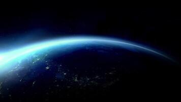 Earth rotating in space with city lights visible at night video