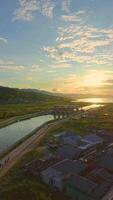Aerial view of Sunset Over River and Village video