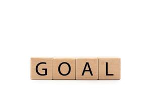 Wooden cube blocks with GOAL text isolated on white background. Business ideas to goals and strategy concept. Copy Space and Clipping path photo
