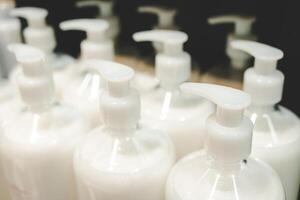 Refill to reduce plastic waste. soap or shampoo for refill. plastic bottles for refill liquid soap, shampoo and other products. photo