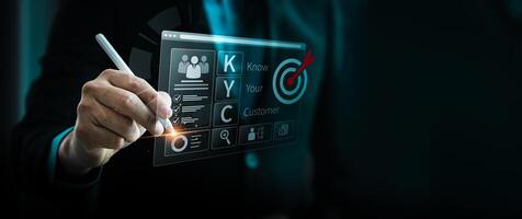 Businessman using a digital pen to interact with a futuristic KYC Know Your Customer interface, representing customer identity verification, compliance, anti-fraud measures, digital banking solutions. photo