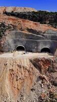 Construction workers and engineers are building a new tunnel through a mountain range in turkey, using heavy machinery and specialized equipment video