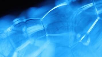 Blue liquid texture in macro, bright fluid background, smooth movement, molecular structure video