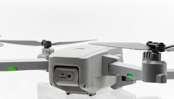 Drone with black propellers ready for flight isolated on white background. Close-up. photo