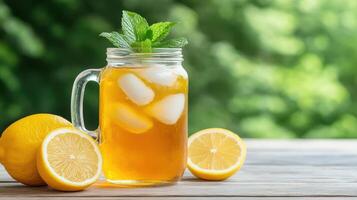 Lemonade in a jar with mint leaves photo